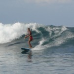 Gaelyn surfs Bay